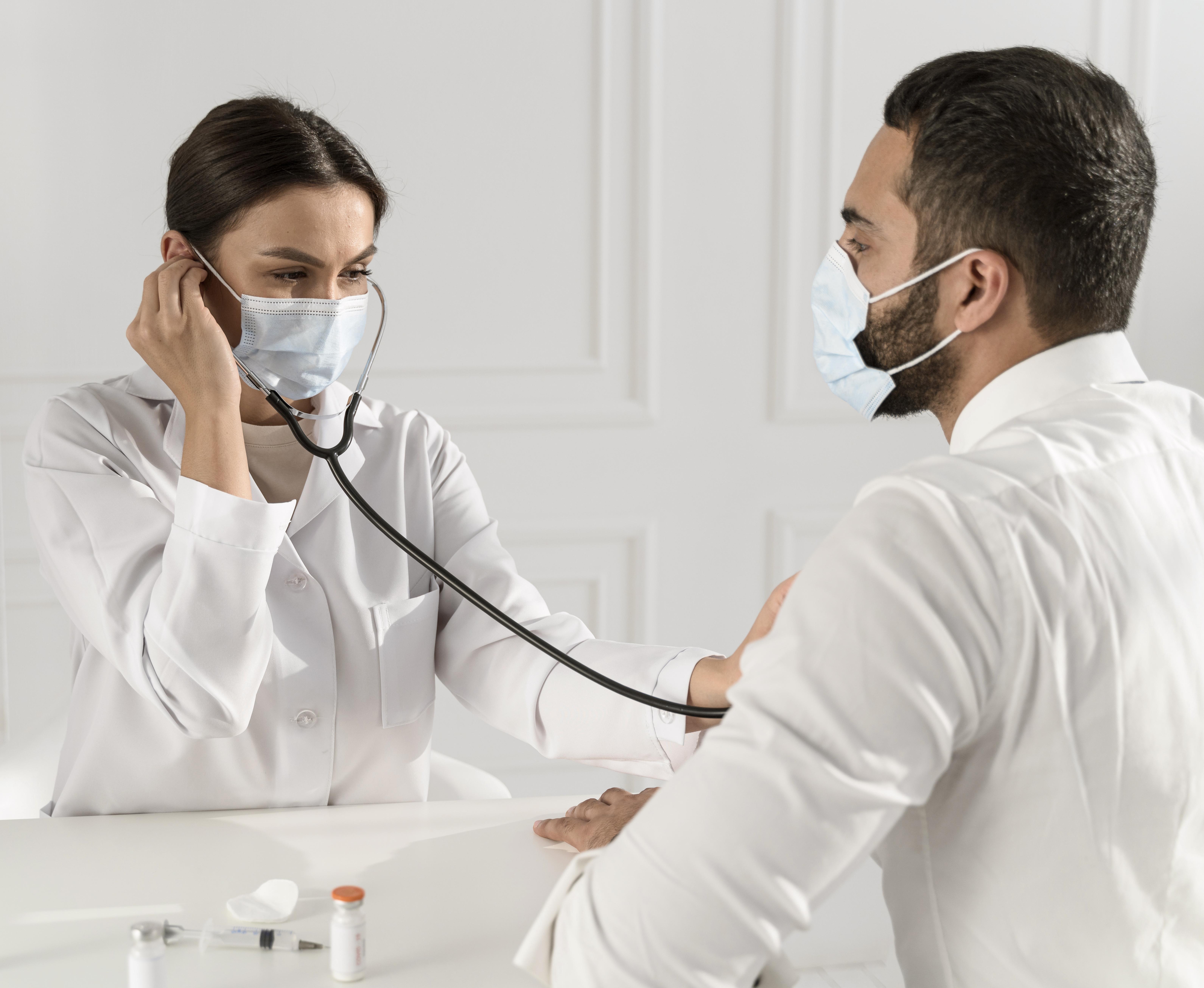 OnCure doctor assisting a mobility patient at home doorstep in Dubai